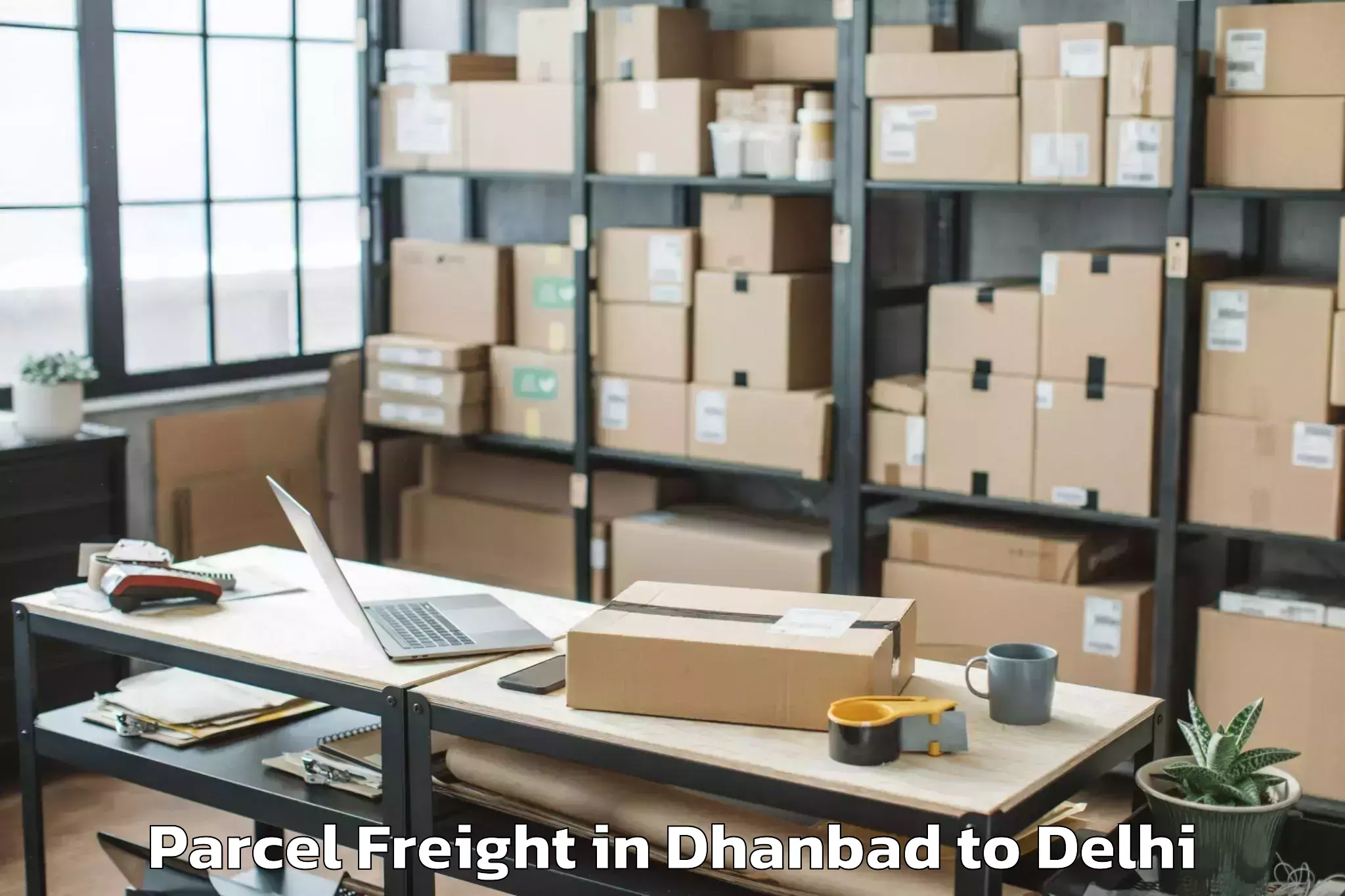 Book Your Dhanbad to University Of Delhi New Delhi Parcel Freight Today